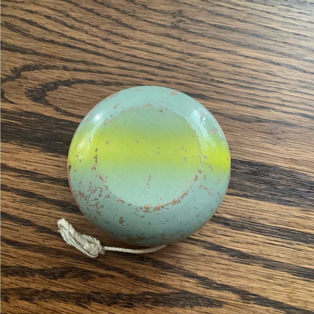 Classic vintage wooden Yo-Yo in Mint Green and Yellow.